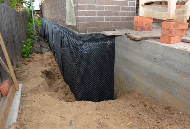 SJ Waterproofing Pros team performing specialized Waterproofing assessment in Kansas, KS